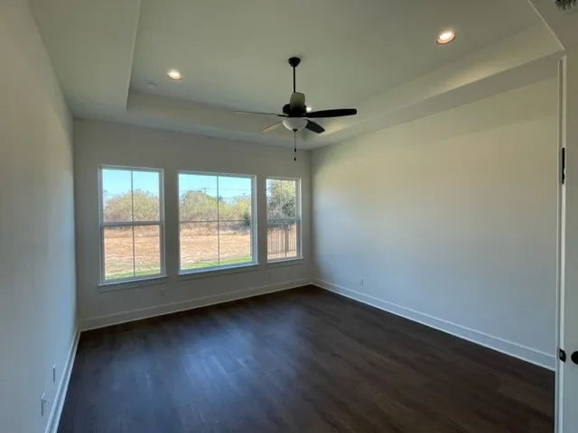 a view of room window and wooden floor
