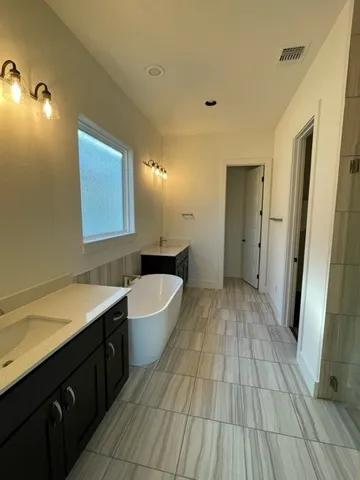 a bathroom with a sink and a bathtub