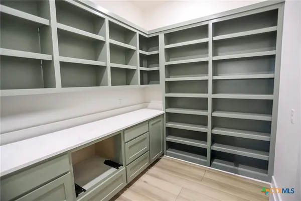 a view of storage and utility room with empty racks