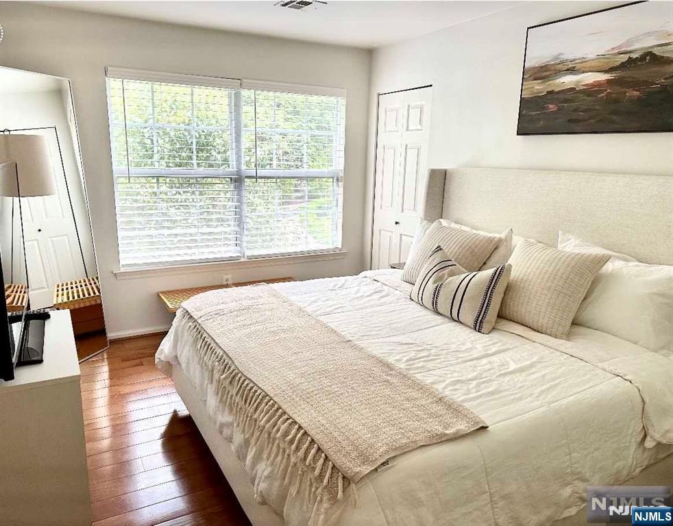 34 Bergen Ridge Road, Unit 2 North Bergen, NJ 07047 - Photo 33 of 41 a bed sitting in a bedroom next to a window