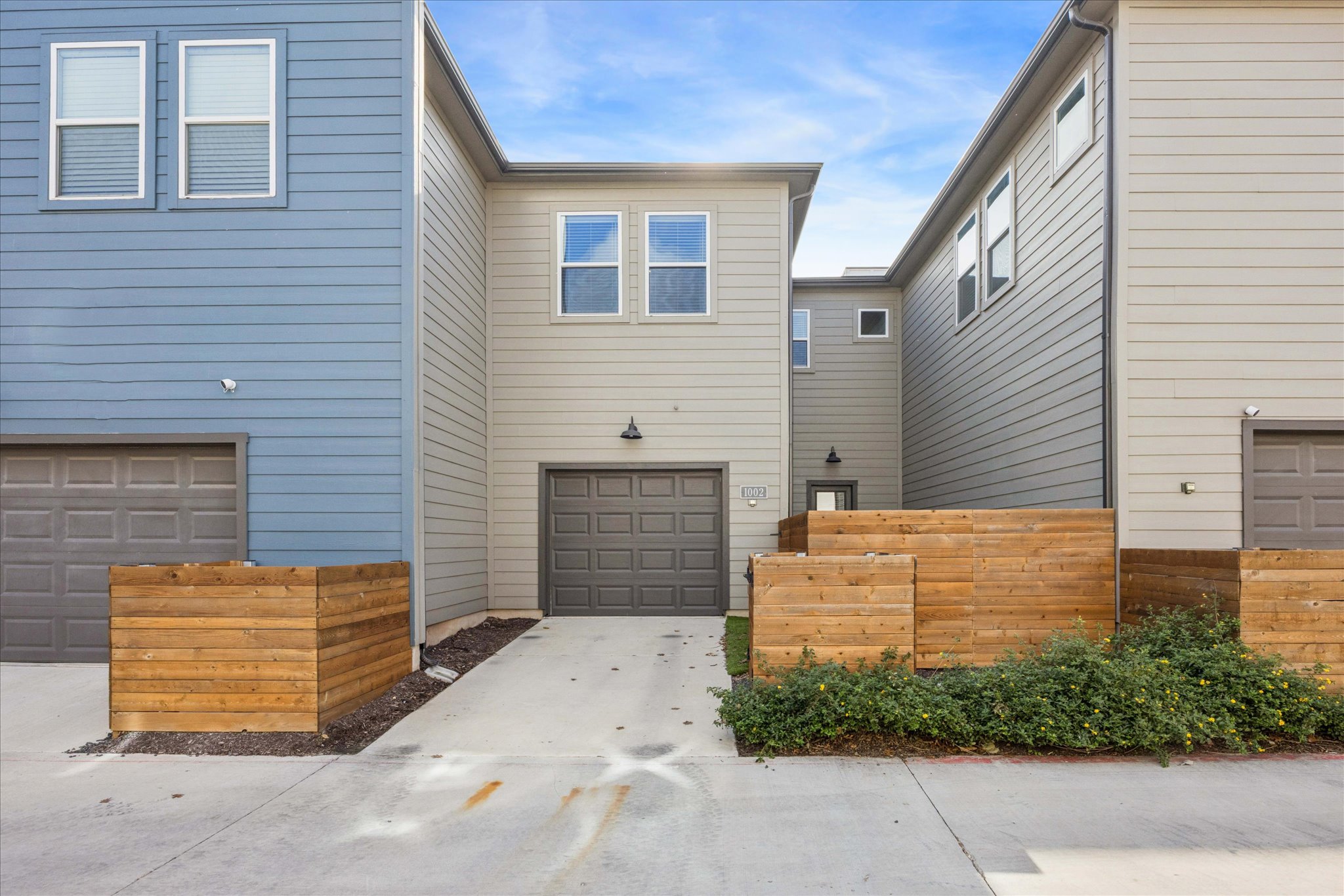 9015 Cattle Baron Path, Unit 1002 Austin, TX 78747 - Photo 20 of 20 a front view of a house with a garage