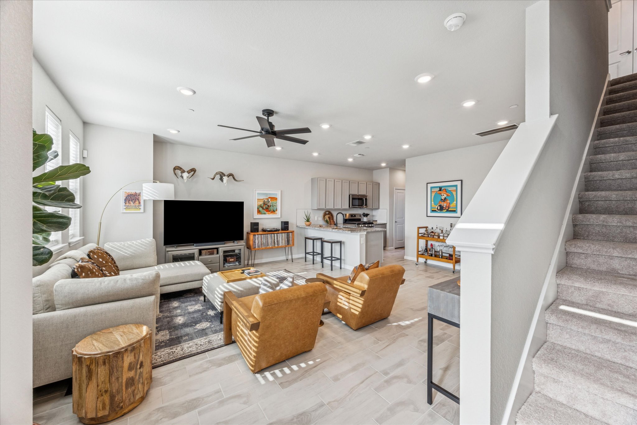 9015 Cattle Baron Path, Unit 1002 Austin, TX 78747 - Photo 3 of 20 a living room with furniture and a flat screen tv