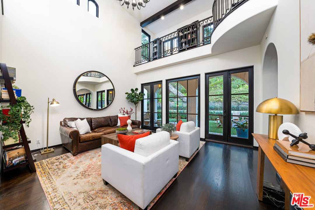 3606 Mandeville Canyon Road Los Angeles, CA 90049 - Photo 14 of 32 a living room with furniture and a large window