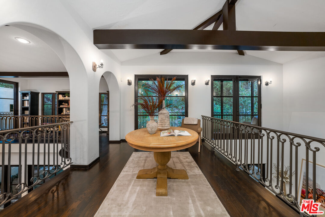 3606 Mandeville Canyon Road Los Angeles, CA 90049 - Photo 23 of 32 a bathroom with a sink a mirror and a window