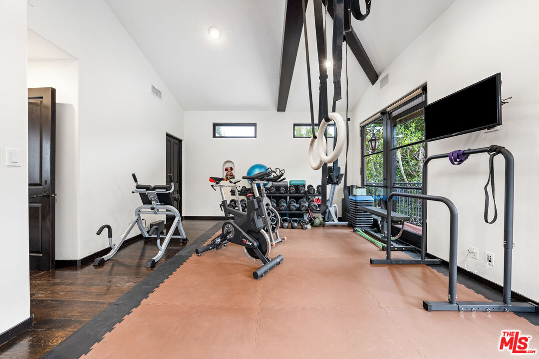 3606 Mandeville Canyon Road Los Angeles, CA 90049 - Photo 28 of 32 a view of a room with gym equipment