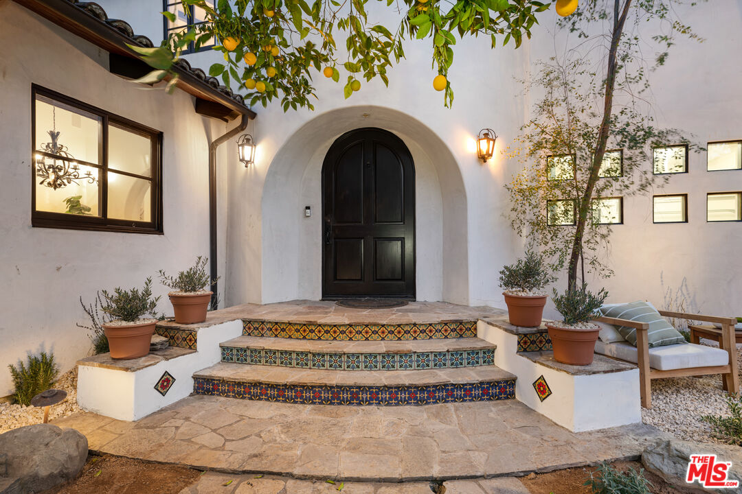 3606 Mandeville Canyon Road Los Angeles, CA 90049 - Photo 3 of 32 a front view of a house with