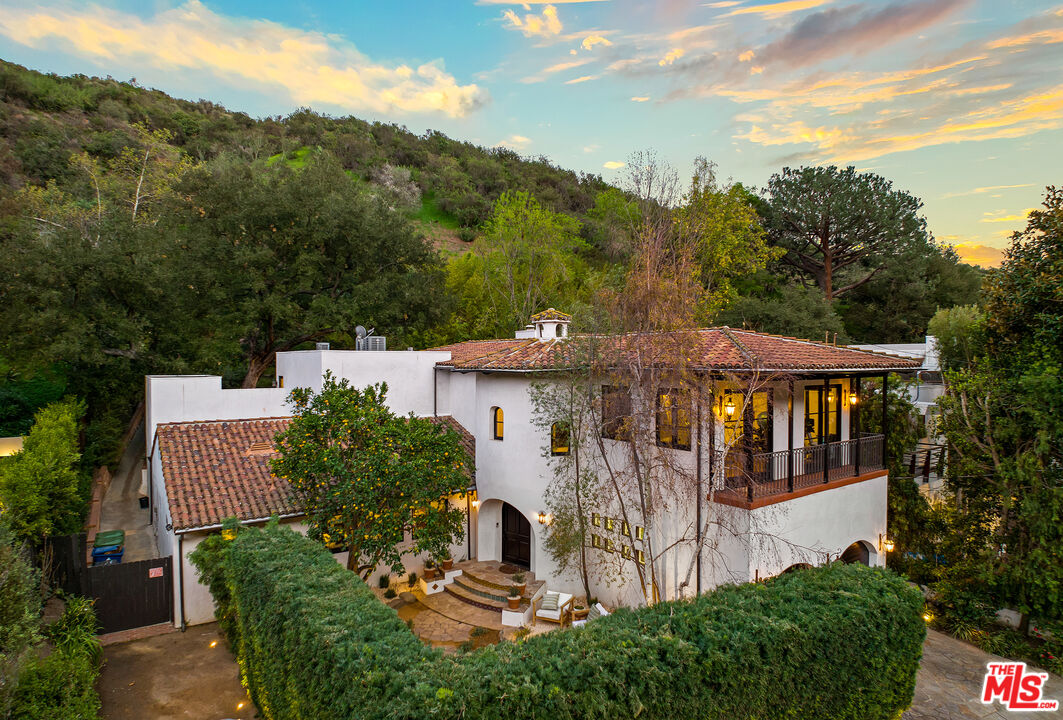 3606 Mandeville Canyon Road Los Angeles, CA 90049 - Photo 32 of 32 an aerial view of a house with porch and garden