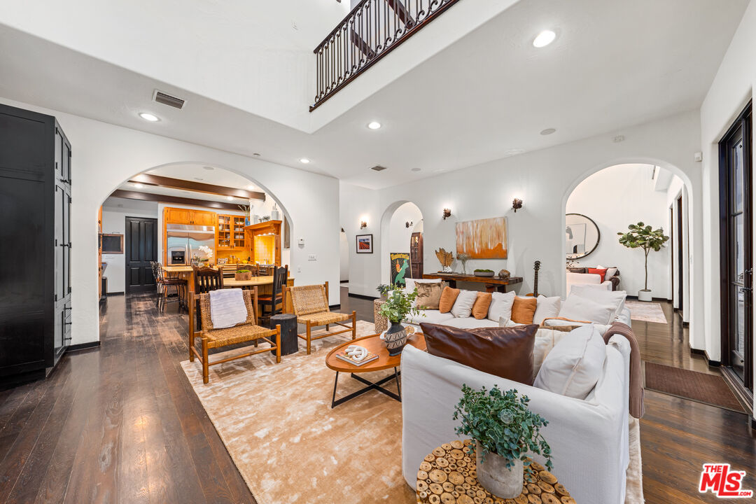 3606 Mandeville Canyon Road Los Angeles, CA 90049 - Photo 6 of 32 a living room with furniture and a large window