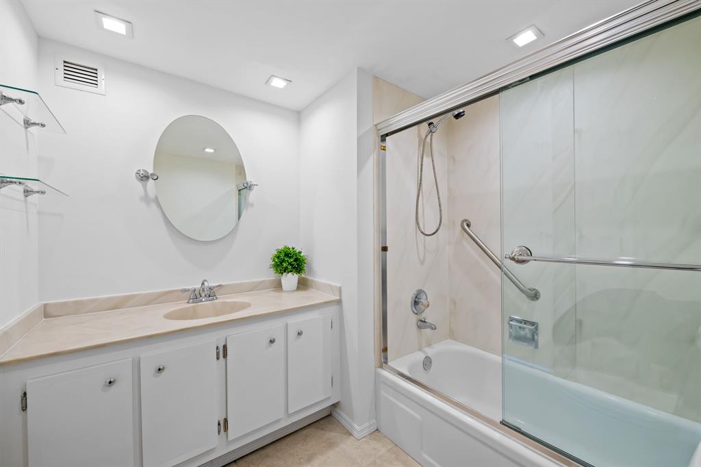 2841 North Ocean Boulevard, Unit 1710 Fort Lauderdale, FL 33308 - Photo 16 of 34 a bathroom with a double vanity sink mirror and bathtub