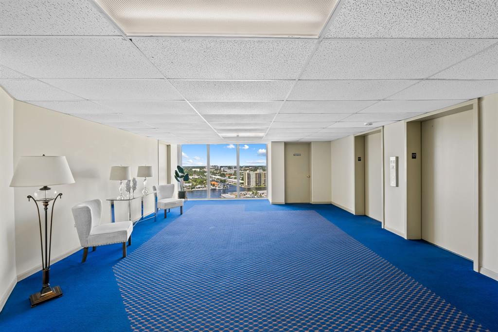 2841 North Ocean Boulevard, Unit 1710 Fort Lauderdale, FL 33308 - Photo 22 of 34 a view of a livingroom with furniture and a kitchen