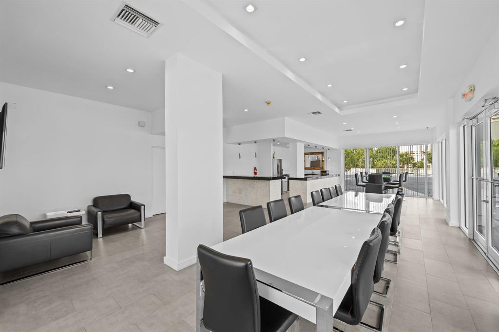 2841 North Ocean Boulevard, Unit 1710 Fort Lauderdale, FL 33308 - Photo 30 of 34 a view of a dining room with furniture