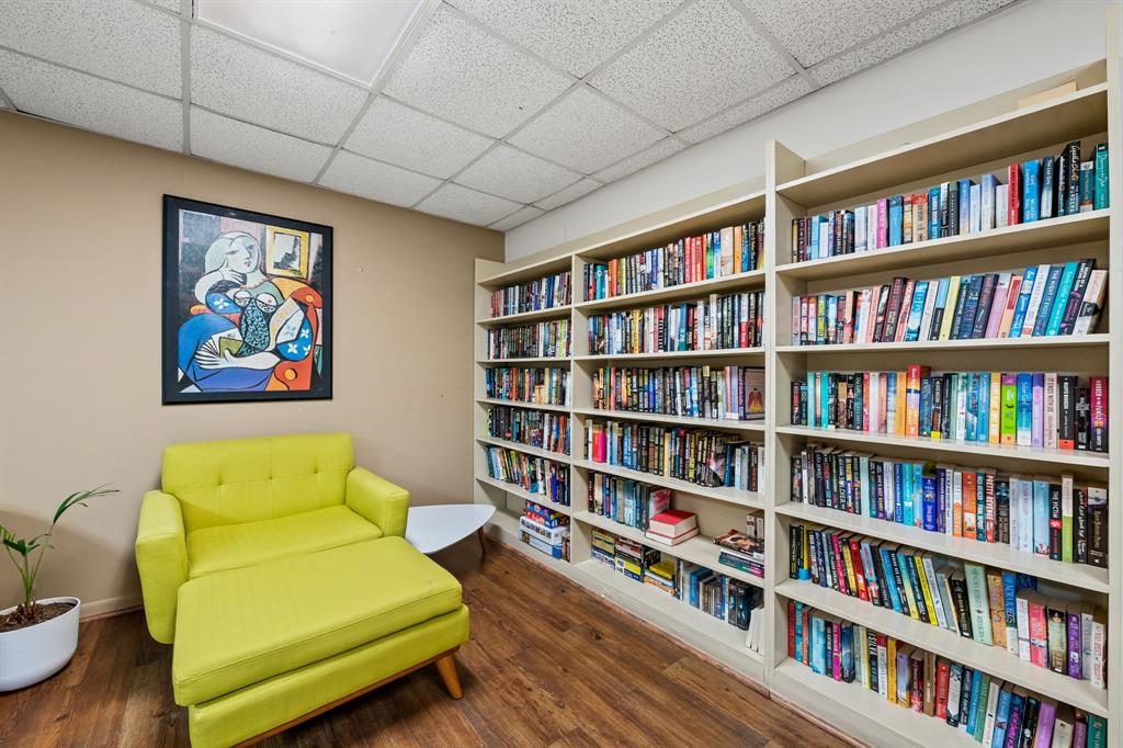 2841 North Ocean Boulevard, Unit 1710 Fort Lauderdale, FL 33308 - Photo 32 of 34 a living room with furniture and a book shelf