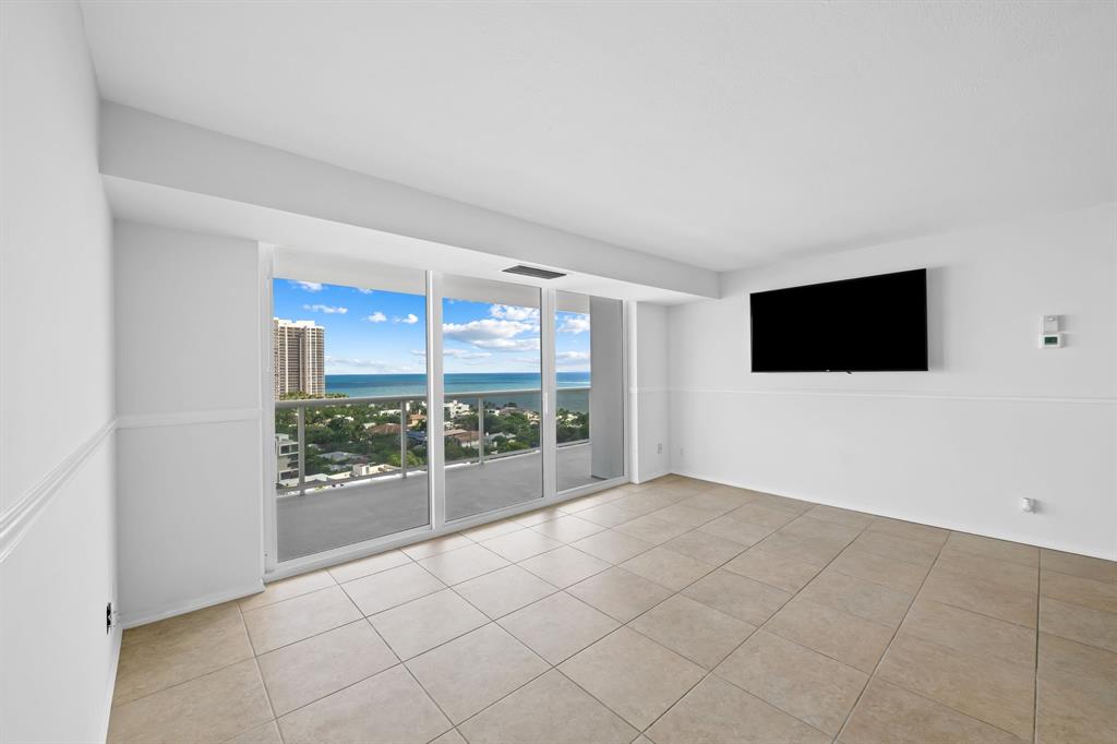 2841 North Ocean Boulevard, Unit 1710 Fort Lauderdale, FL 33308 - Photo 9 of 34 a view of an empty room with a tv