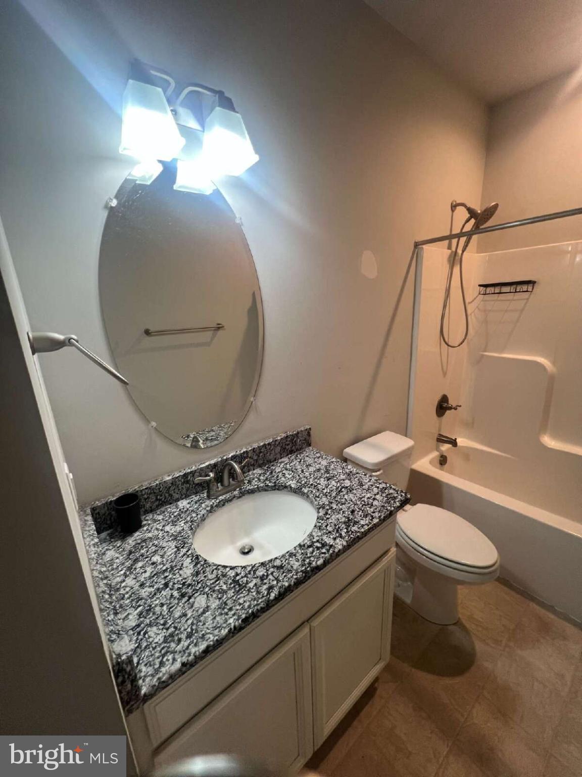 90 Hickory Ridge Circle Mineral, VA 23117 - Photo 11 of 21 a bathroom with a granite countertop sink toilet and a mirror