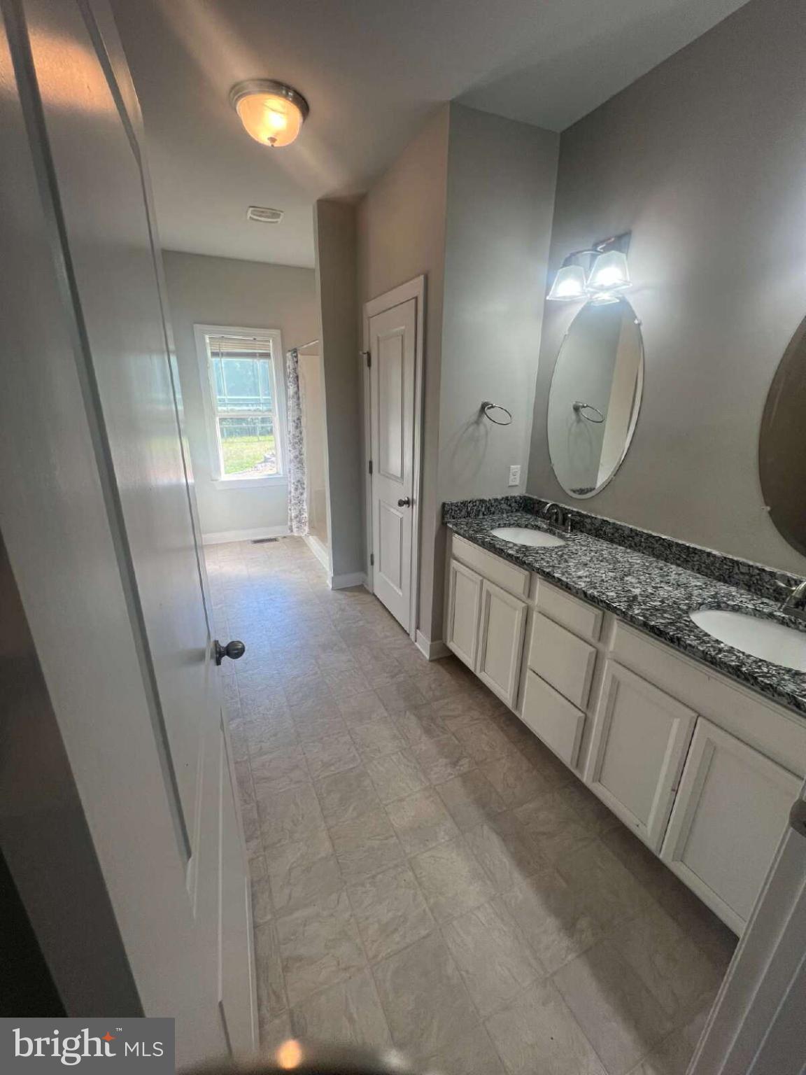 90 Hickory Ridge Circle Mineral, VA 23117 - Photo 14 of 21 a bathroom with a double vanity sink and a mirror
