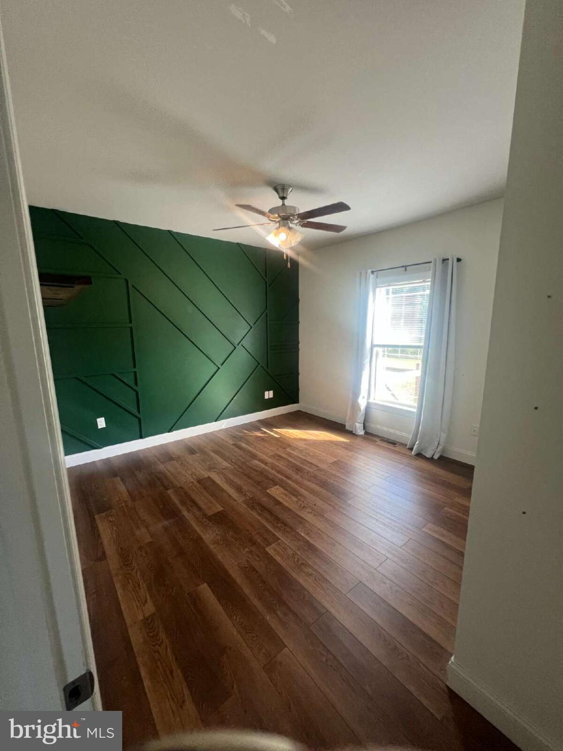 90 Hickory Ridge Circle Mineral, VA 23117 - Photo 6 of 21 a view of a livingroom with wooden floor and a ceiling fan