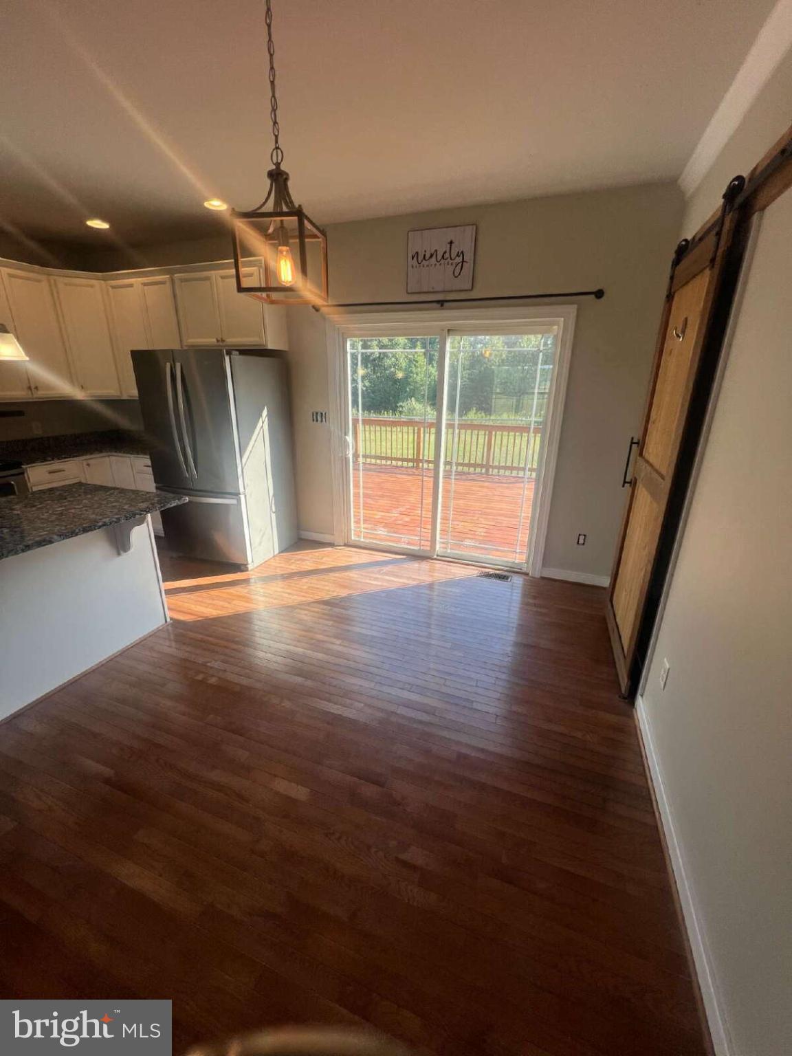 90 Hickory Ridge Circle Mineral, VA 23117 - Photo 8 of 21 a view of an empty room with wooden floor and a window