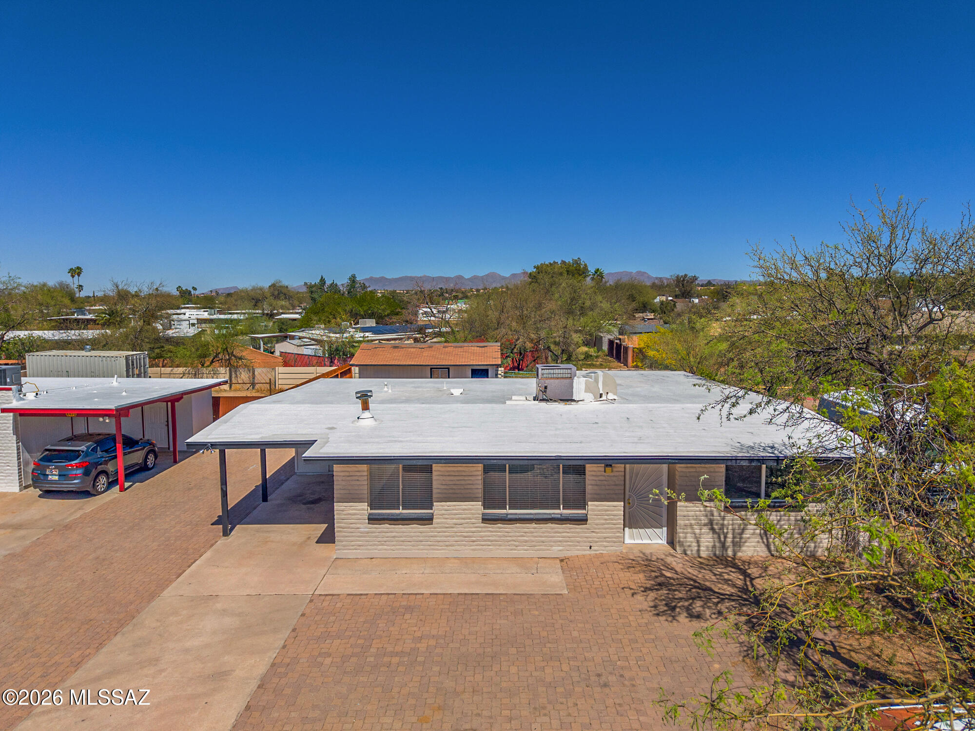 4400 West Ina Road Tucson, AZ 85741 - Photo 1 of 43 a view of a terrace with a table and chairs under an umbrella