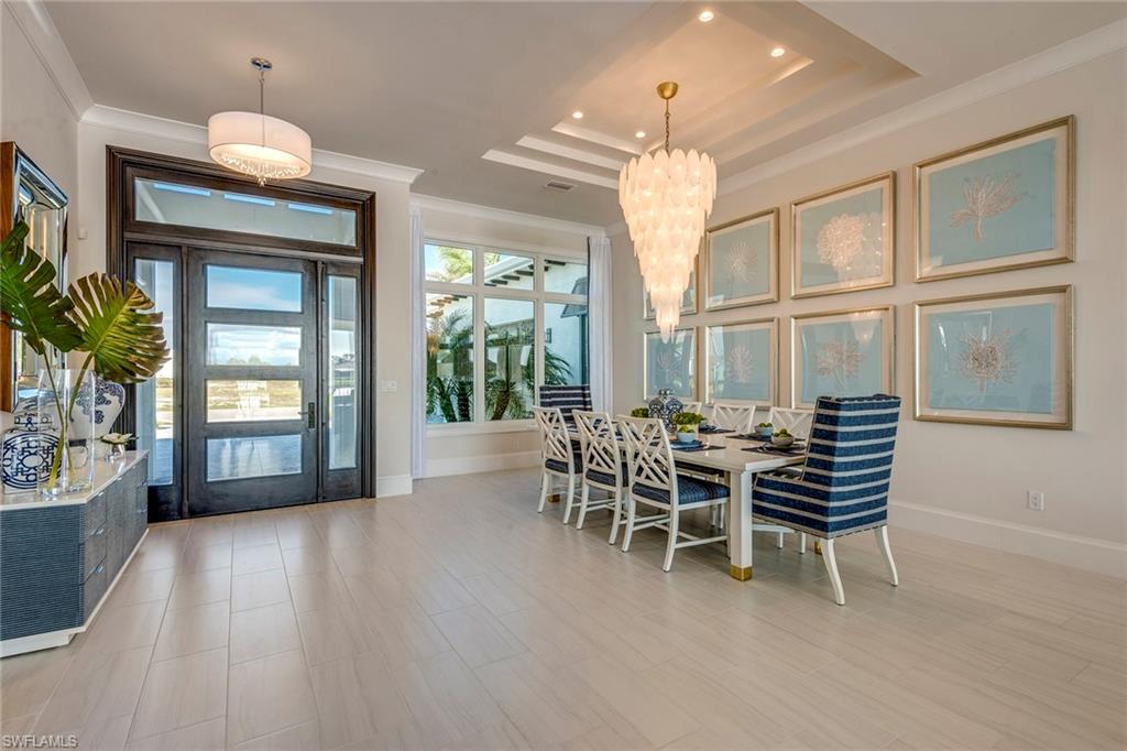 9828 Montiano Place Naples, FL 34113 - Photo 12 of 30 a view of a livingroom with furniture and window