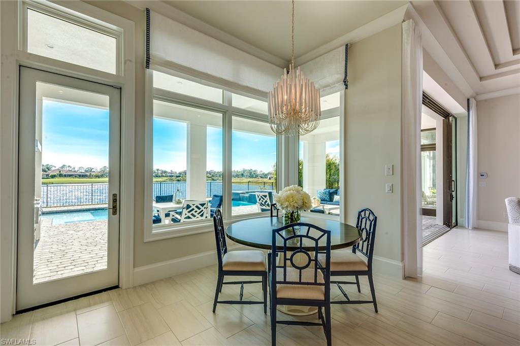 9828 Montiano Place Naples, FL 34113 - Photo 18 of 30 a dining room with furniture and window