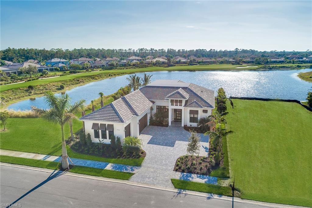 9828 Montiano Place Naples, FL 34113 - Photo 2 of 30 an aerial view of a house with outdoor space lake view and mountain view