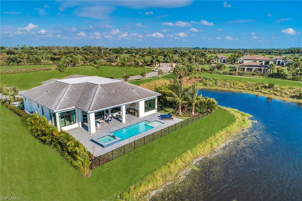 9828 Montiano Place Naples, FL 34113 - Photo 3 of 30 a aerial view of a house with a garden