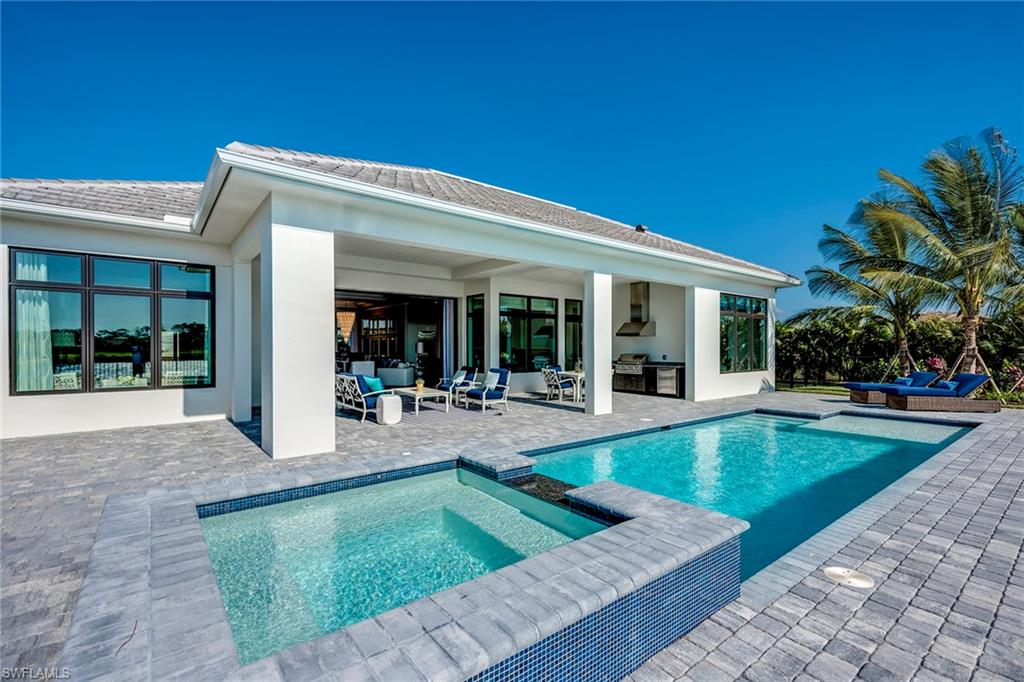 9828 Montiano Place Naples, FL 34113 - Photo 4 of 30 a view of outdoor space yard swimming pool and patio