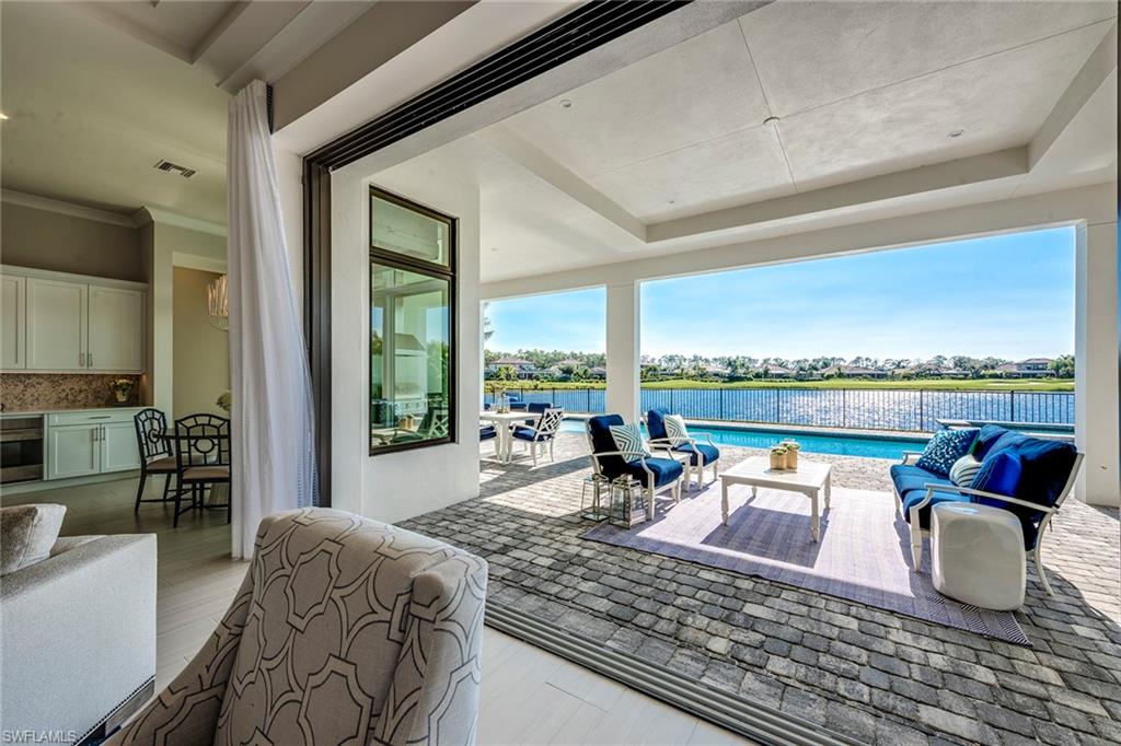 9828 Montiano Place Naples, FL 34113 - Photo 7 of 30 a living room with furniture