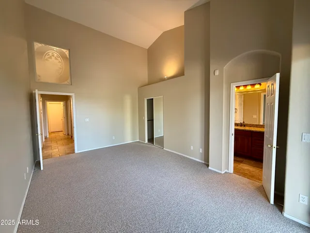 a view of empty room with a bathroom