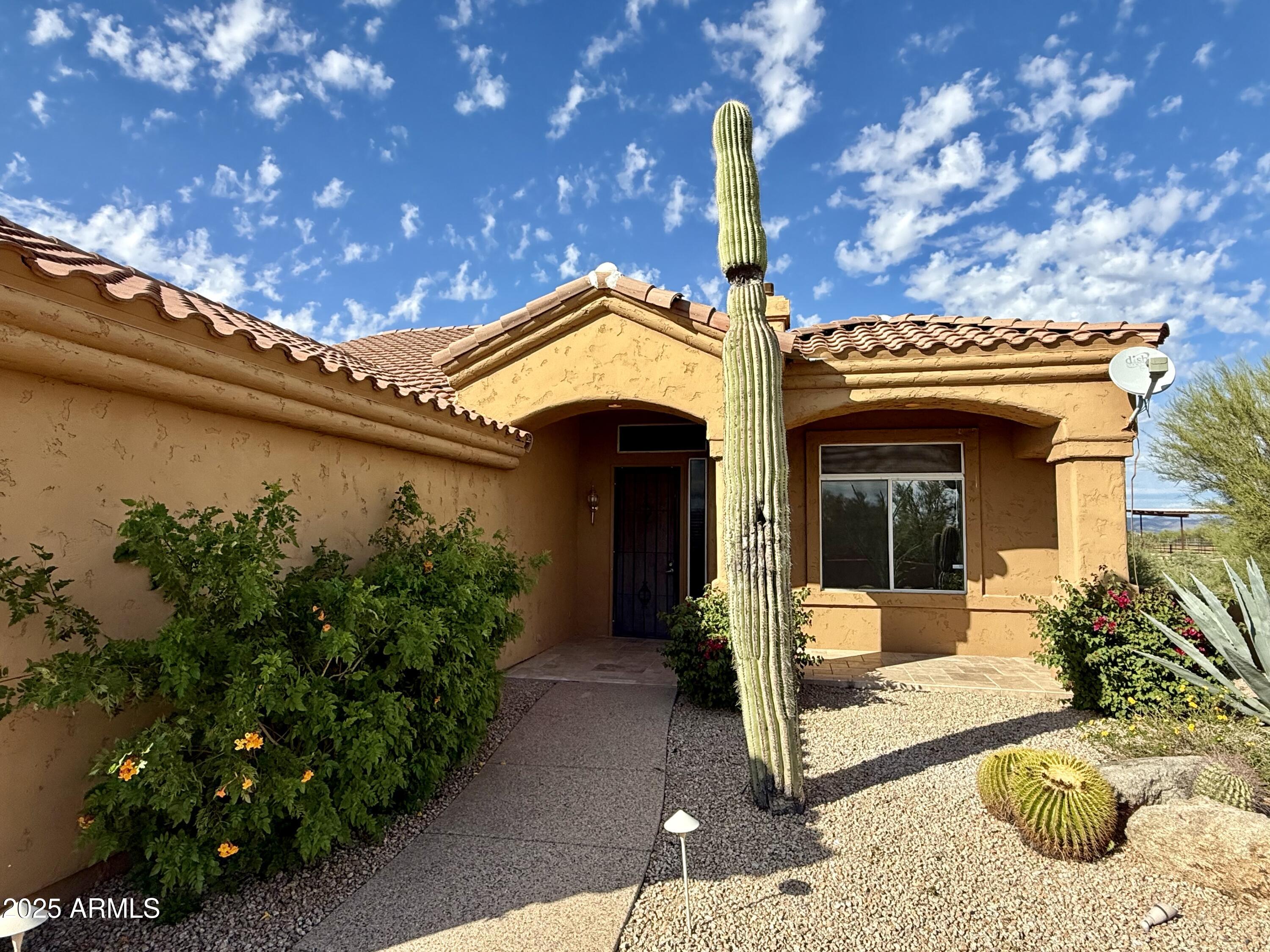 26646 North 148th Street Scottsdale, AZ 85262 - Photo 2 of 37 a front view of a house with garden