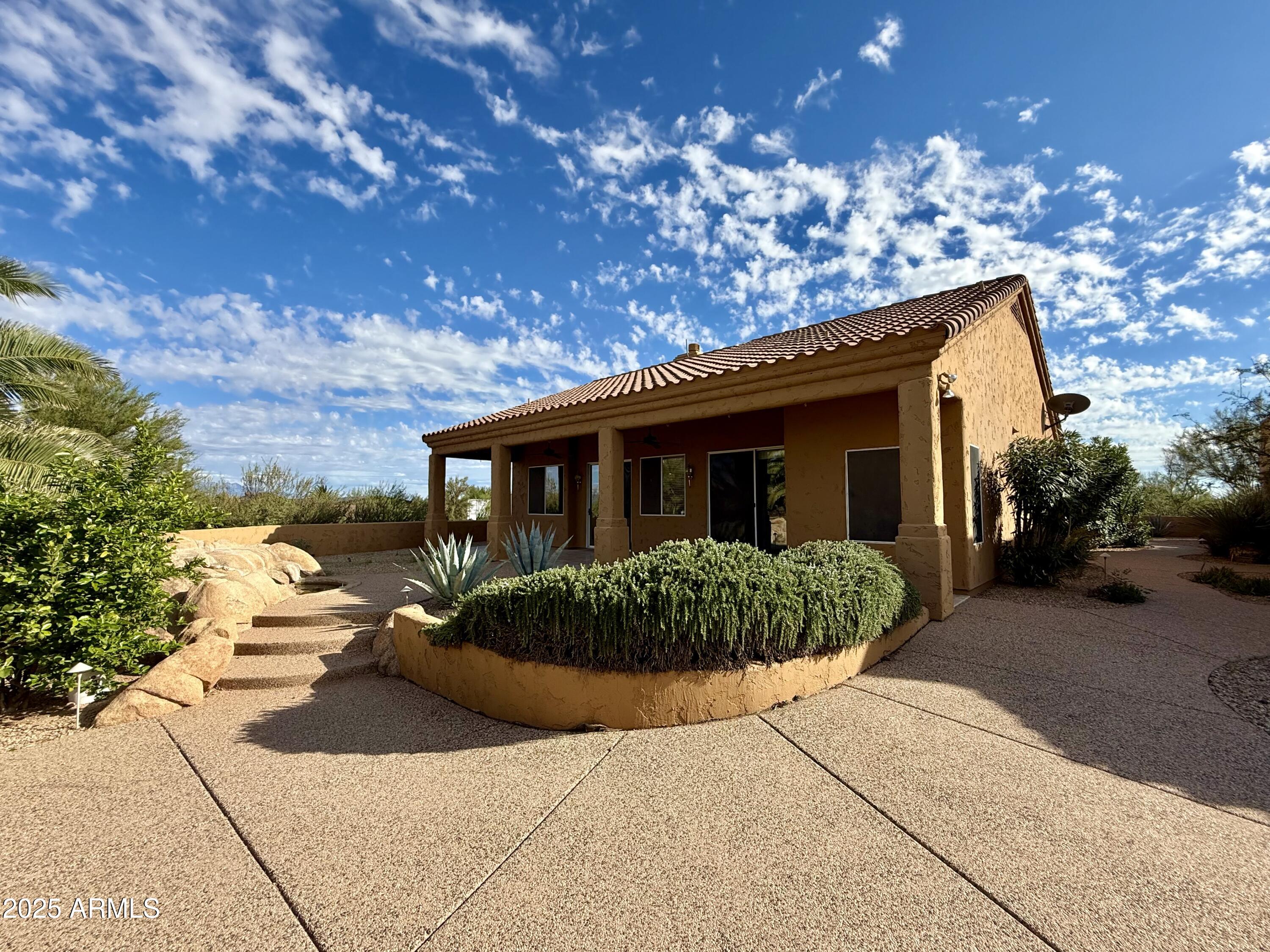 26646 North 148th Street Scottsdale, AZ 85262 - Photo 23 of 37 a front view of a house with garden