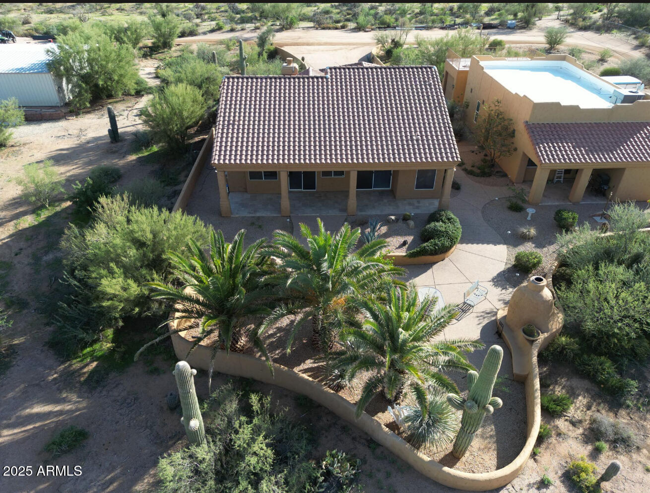 26646 North 148th Street Scottsdale, AZ 85262 - Photo 24 of 37 a front view of a house with a garden