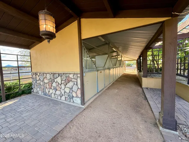 a view of a porch with wooden floor