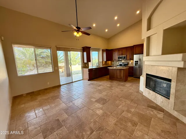a view of a kitchen with a stove top oven cabinets and a kitchen