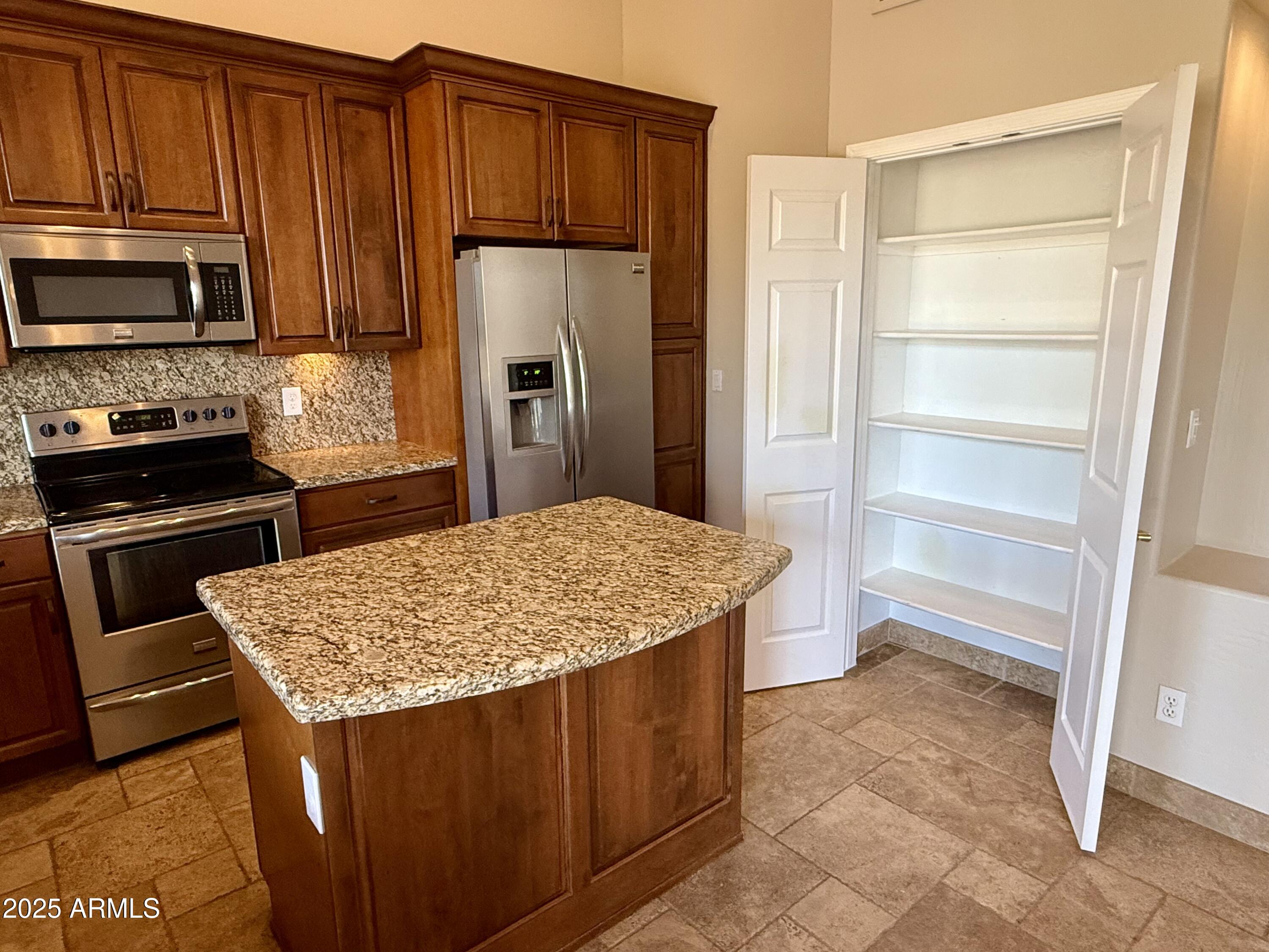 26646 North 148th Street Scottsdale, AZ 85262 - Photo 6 of 37 a kitchen with a wooden floor and a refrigerator