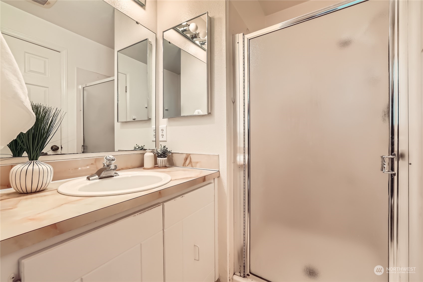 1121 204th Place Southeast Bothell, WA 98012 - Photo 18 of 28 a bathroom with a sink and a mirror