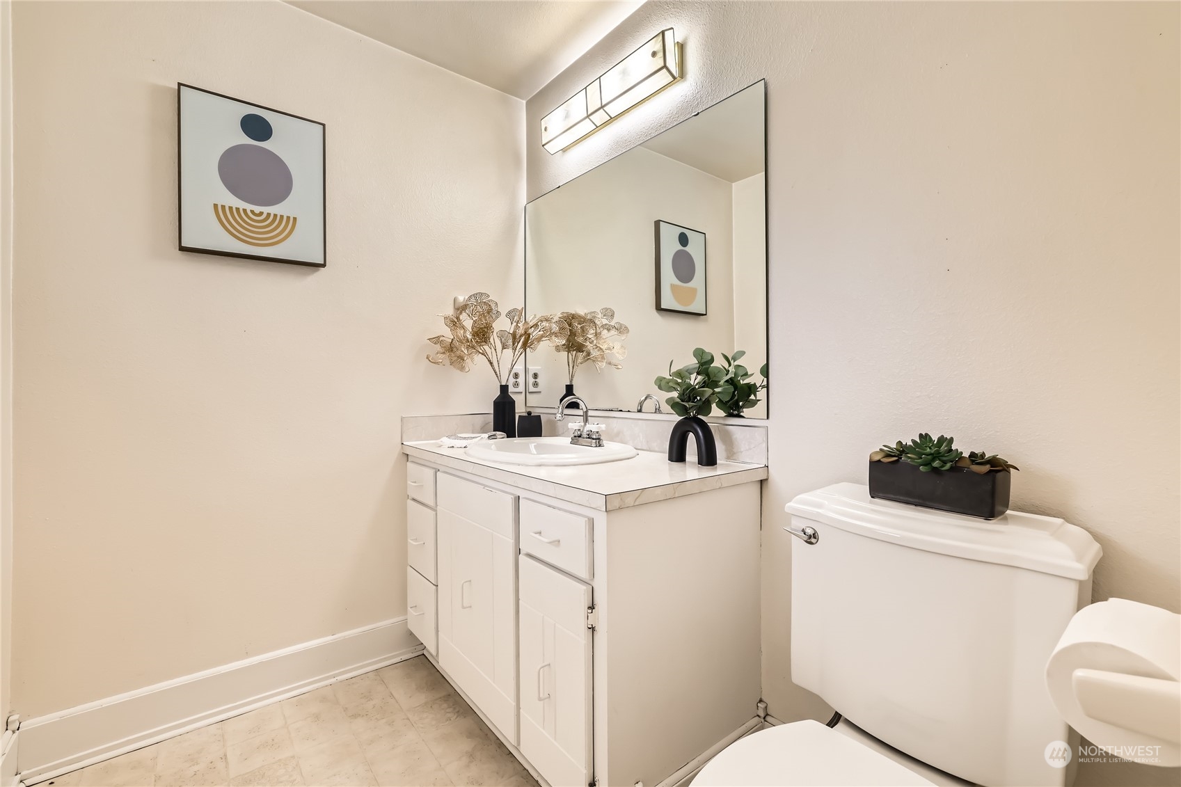 1121 204th Place Southeast Bothell, WA 98012 - Photo 23 of 28 a bathroom with a toilet sink and mirror