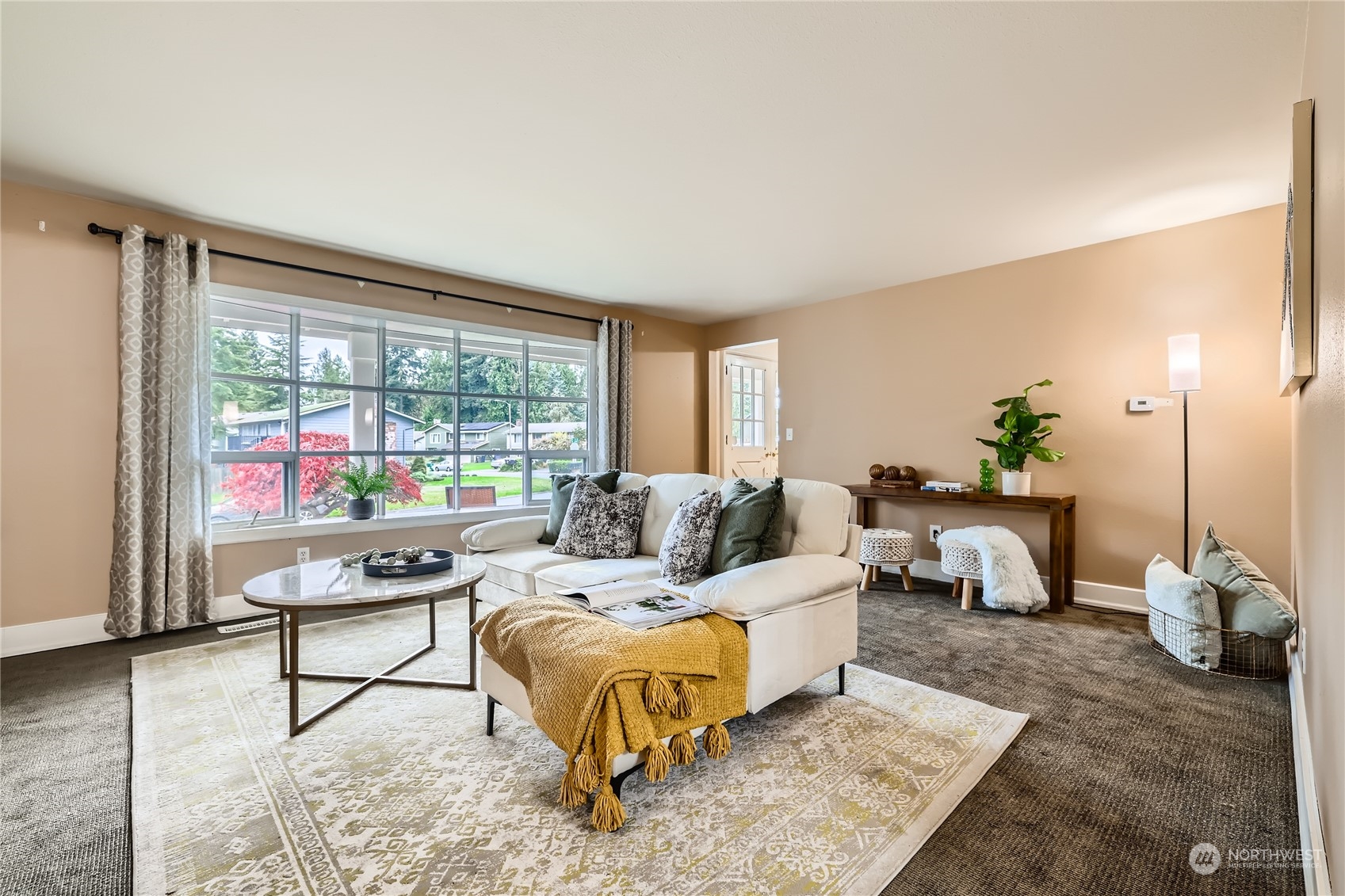 1121 204th Place Southeast Bothell, WA 98012 - Photo 3 of 28 a living room with furniture and a large window