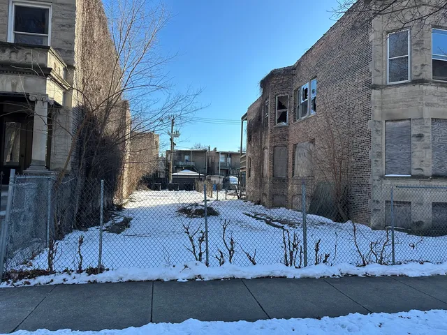 a view of a house with a street