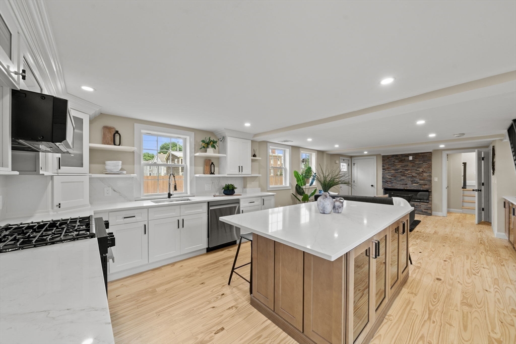162 High Street, Unit B Danvers, MA 01923 - Photo 2 of 32 a kitchen with a sink microwave and stove