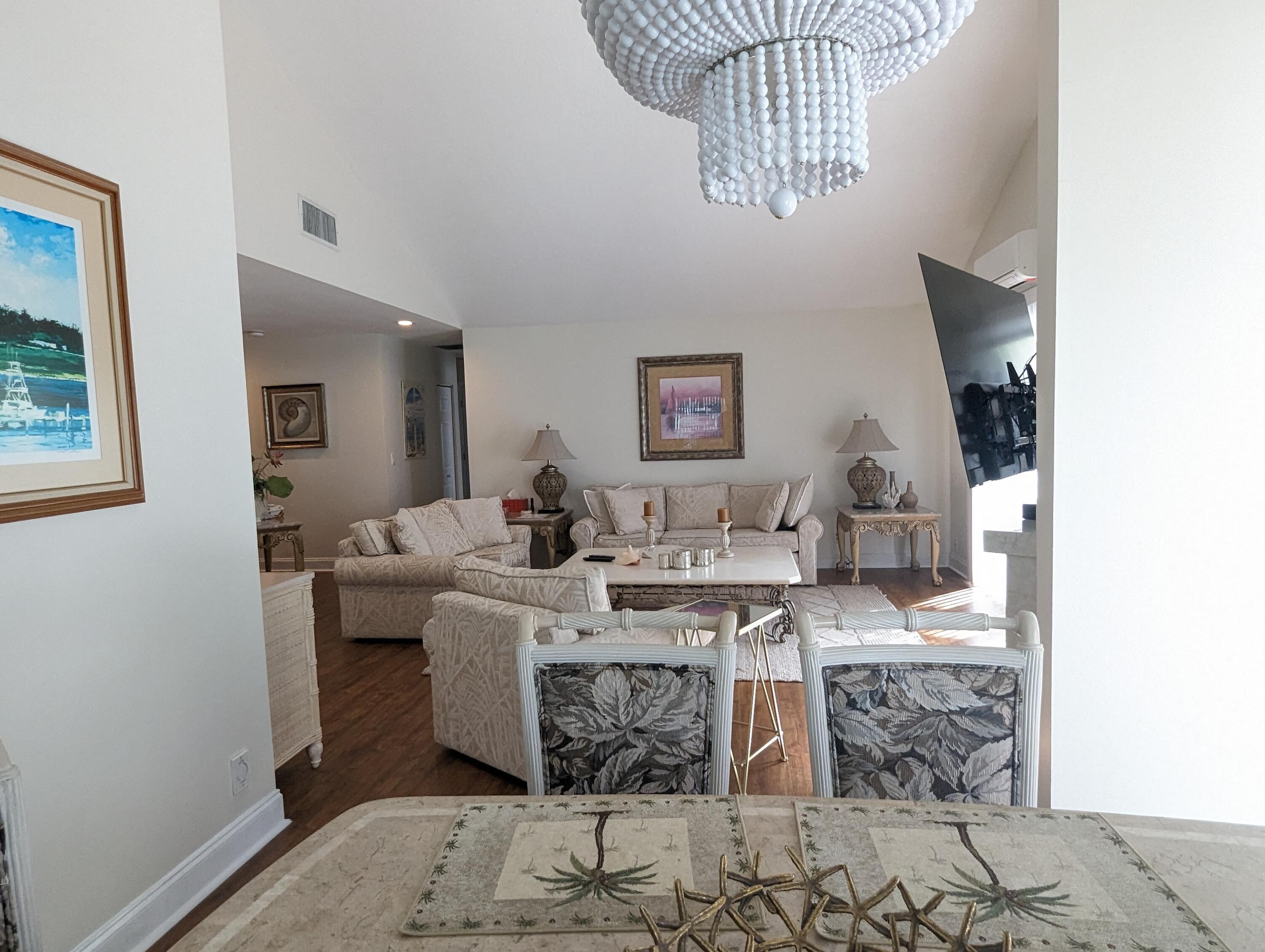 17042 Traverse Circle Jupiter, FL 33477 - Photo 5 of 30 a living room with fireplace furniture and a window