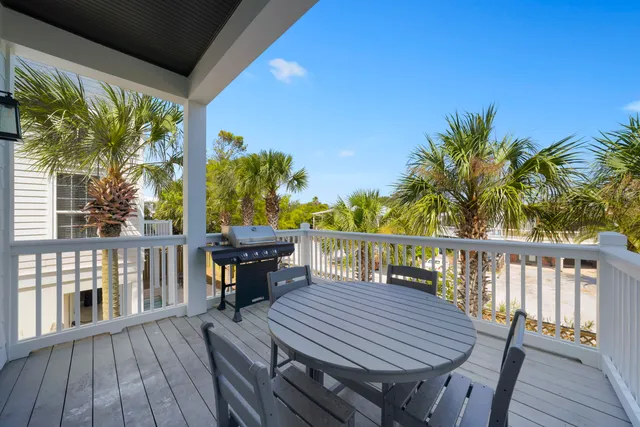 a bedroom with a bed and a lamp on the dresser