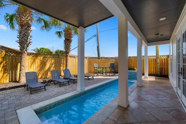 a large bedroom with a large bed and a large window