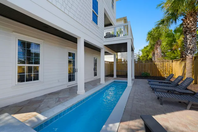 a bathroom with a shower sink vanity mirror and toilet