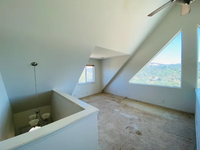 a view of a room with window and stairs