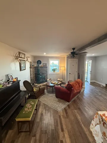a kitchen with a sink stove top oven and refrigerator