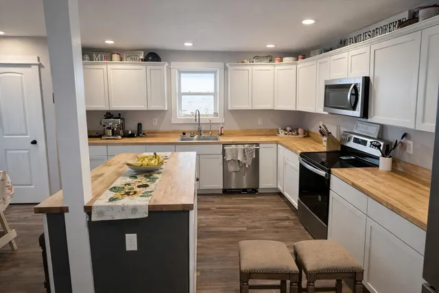 a bathroom with a sink toilet and a mirror