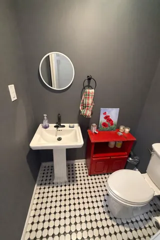 a bedroom with a bed and flat screen tv