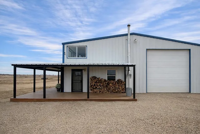 a front view of a house with mountain