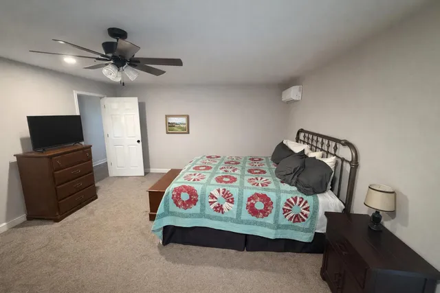 a bathroom with a tub a sink and a shower